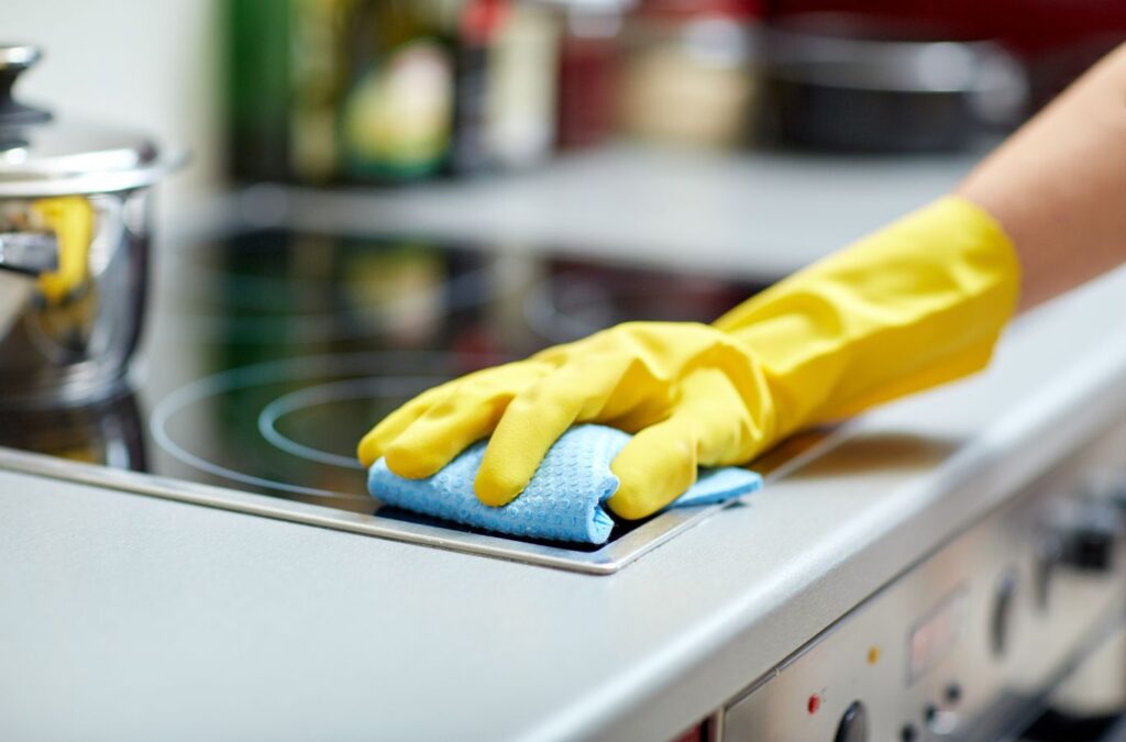 A Honeycomb Home Cleaning pro performing Deep Cleaning in Sylmar, CA, showcasing sanitizing, scrubbing, local service.