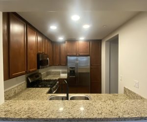 Skilled Honeycomb cleaner efficiently organizing and cleaning a living space in Santa Clarita, providing peace of mind to homeowners